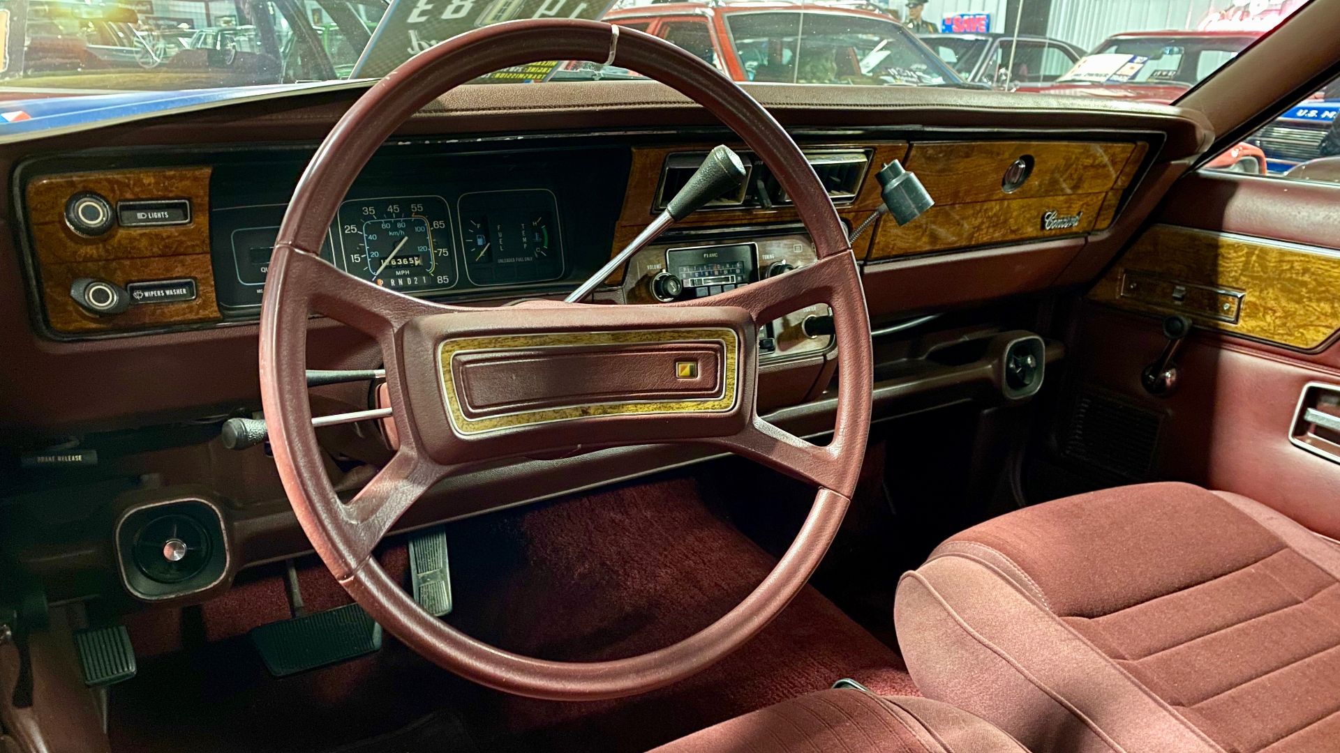 1983 AMC Concord D/L station wagon finished in Deep Maroon with Mist Silver bodyside two-tone metallic paints. The compact-sized four-door wagon came with a rear cargo access hatch as well as an adjustable roof rack. This car has AMC's available roof carr