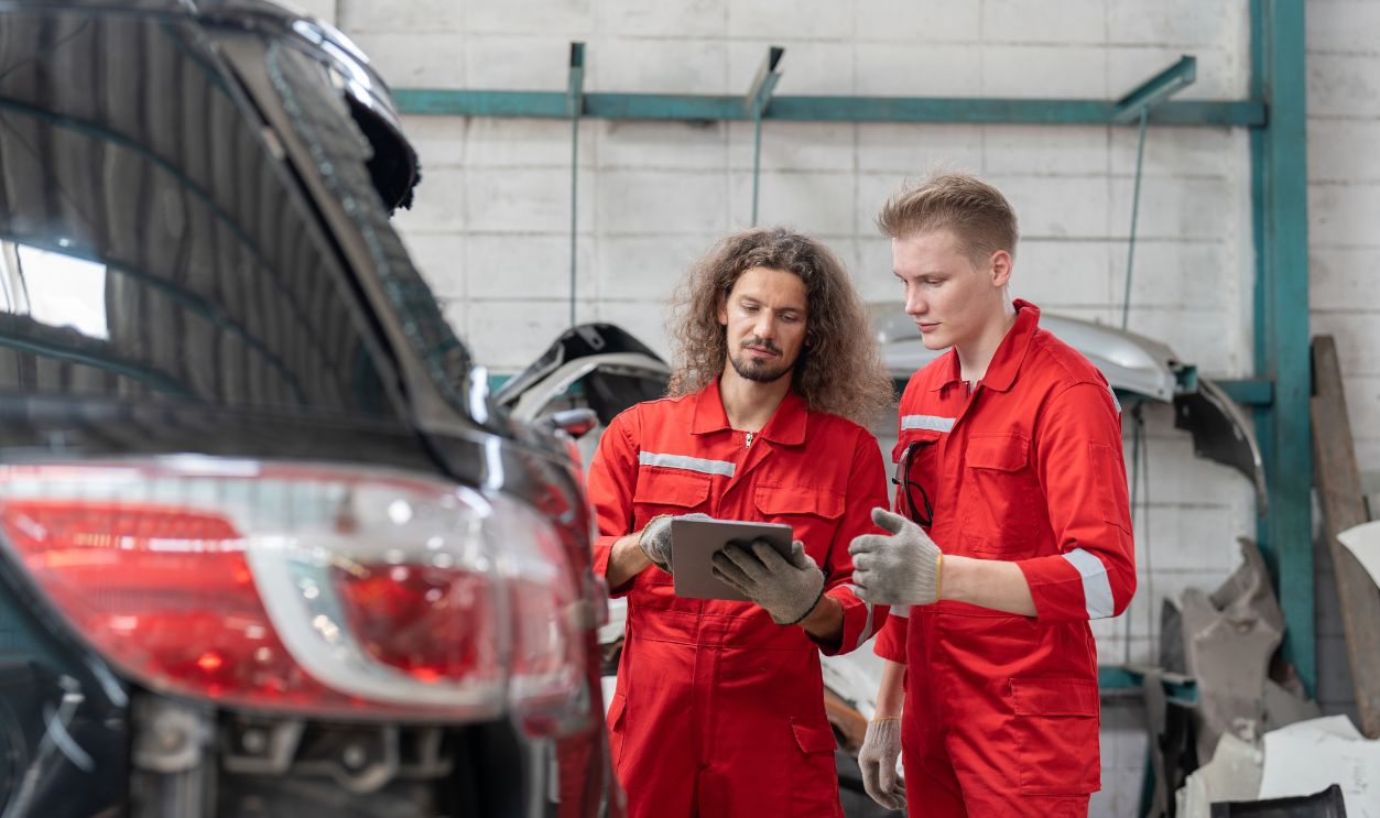 Car mechanics talking