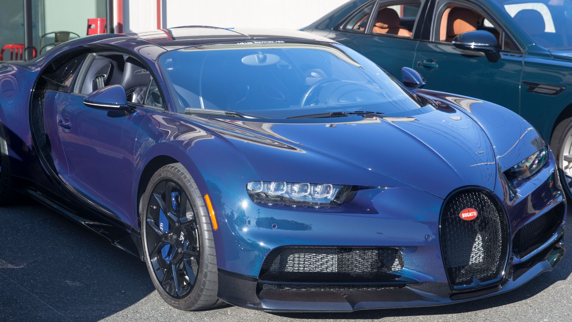 2018 Bugatti Chiron in Exposed Blue Carbon with Black interior at the September 2023 Caffeine and Carburetors in New Canaan, CT. 1080 miles in five years. I guess I don't see what the point was.