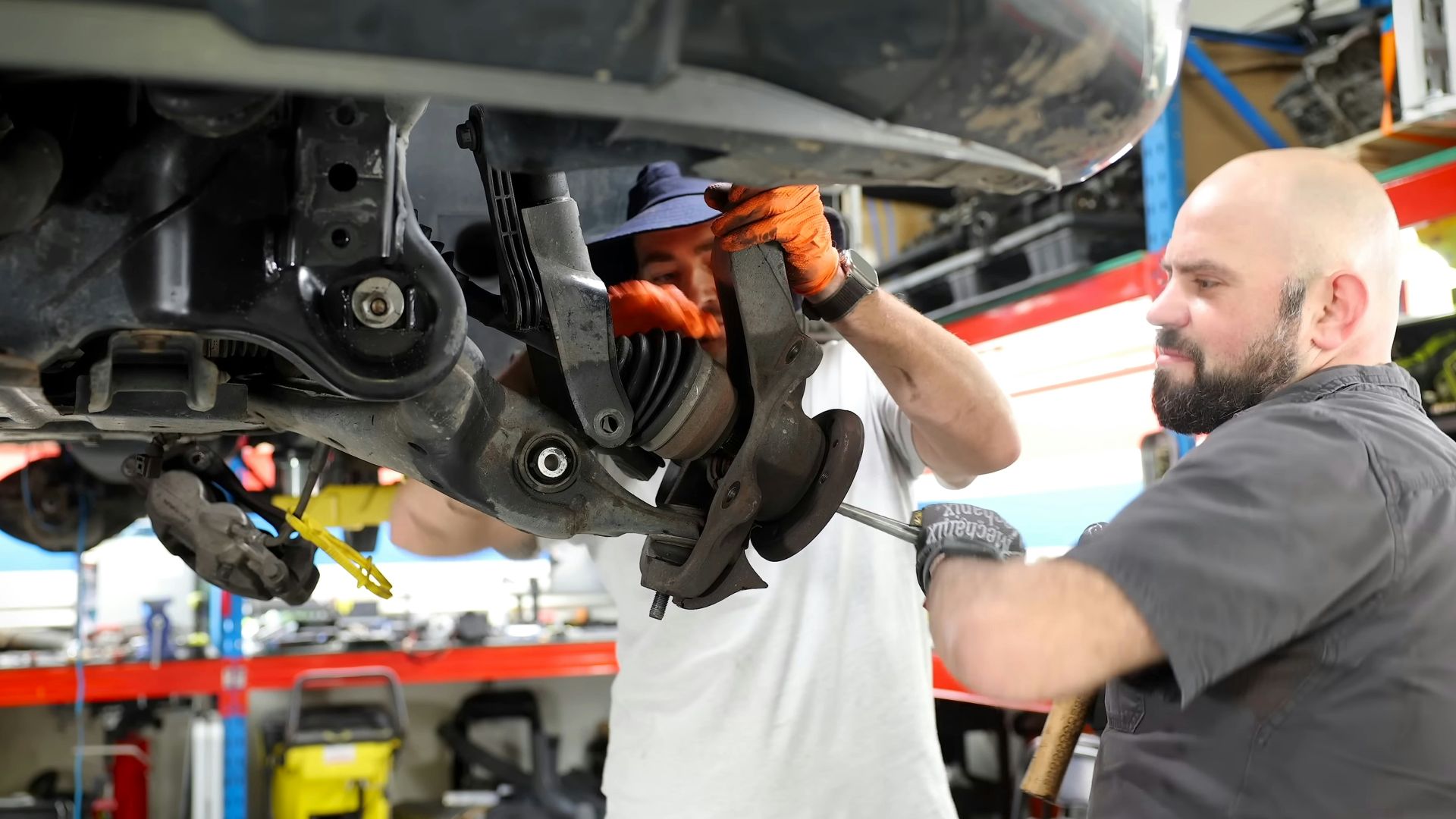 A man working on a car in a garage