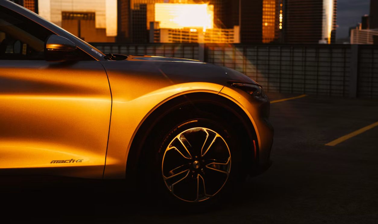 yellow car in front of building