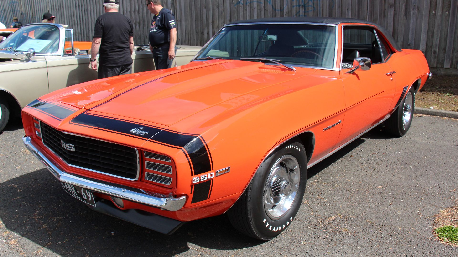 Hugger Orange. 
In 1969, the Camaro got all new sheet metal, except the hood and trunk lid, but the drivetrain stayed much the same, the grille got a distinctive V shape and the headlights were inset. It looked lower, wider and more aggressive.
Available 