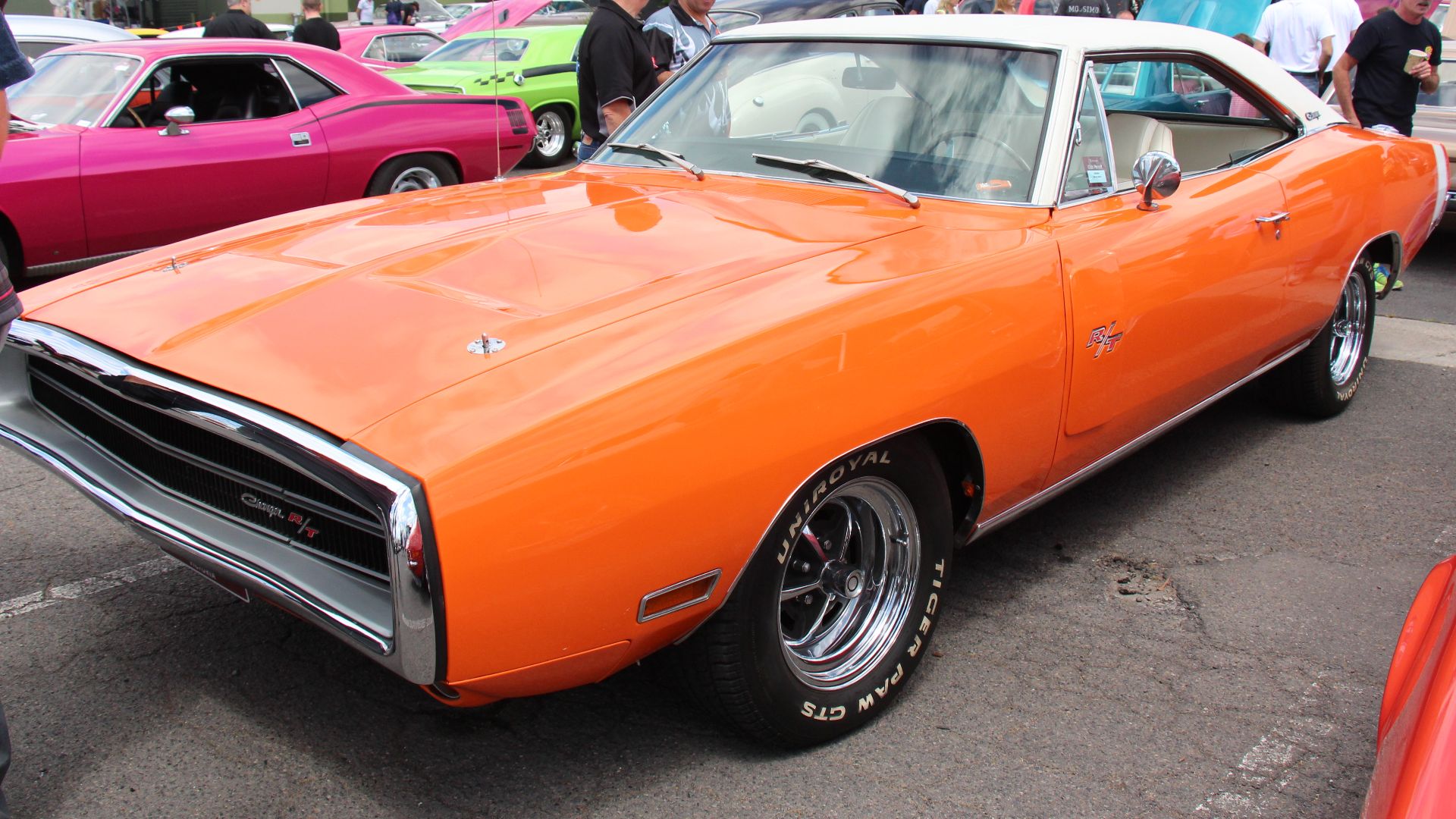 Go Mango. 
The Daytona was a high-performance, limited-edition version of the Dodge Charger produced in the summer of 1969 for the sole purpose of winning high profile NASCAR races. 
It had an 18 inch fiberglass nose extension and a huge rear wing mounted