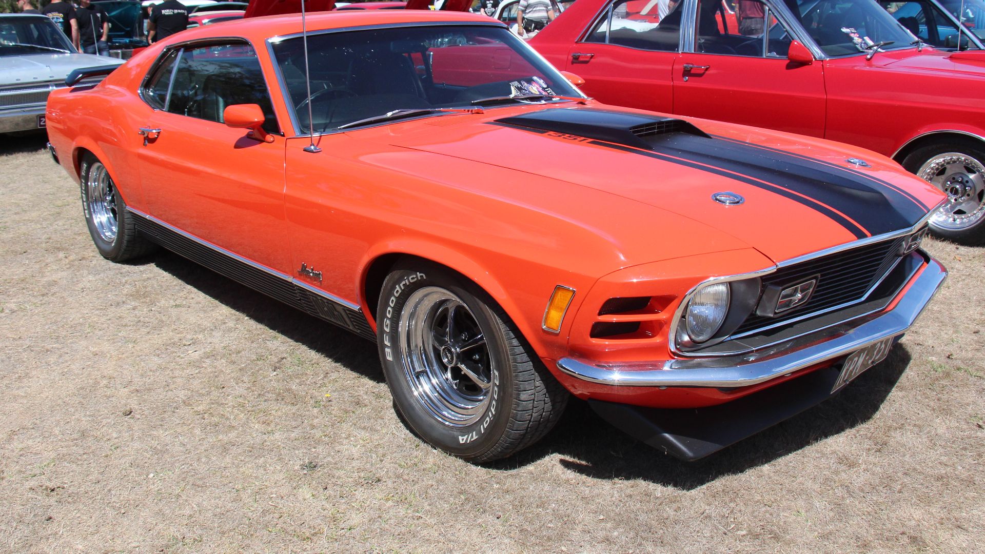 Calypso Coral 
Fords Pony car, the Mustang was first introduced in April, 1964. 
The 1970 Mustang was a facelift of the 1969 model, the headlights were moved inside the grille and imitation vents added to the outside where the 69 headlights were, the rear