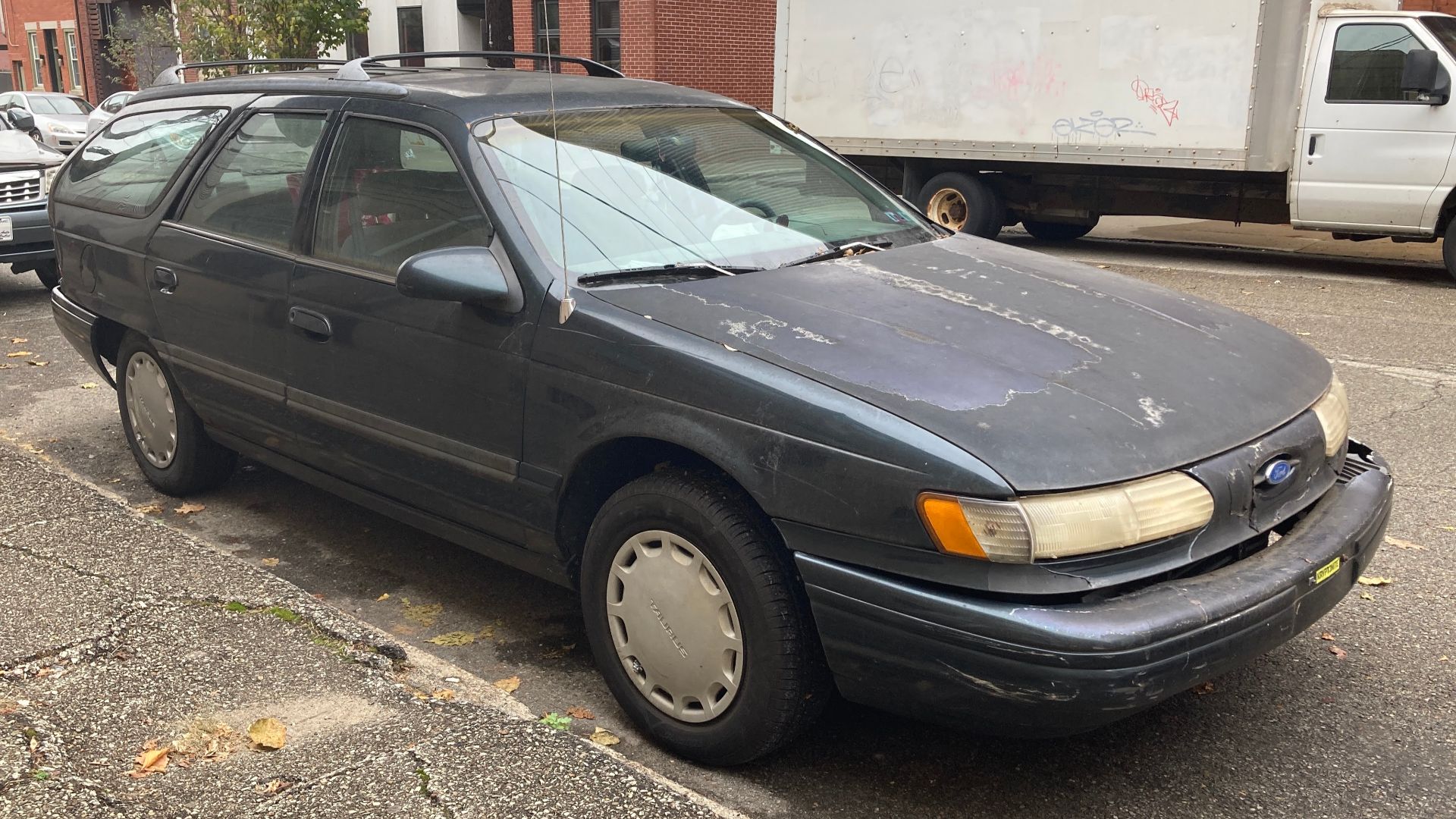 A 1994 Ford Taurus GL Wagon in Medium Willow Green Clearcoat Metallic. This Taurus is equipped with the 3.0L V6 engine, and assembled in Hapeville, Georgia.