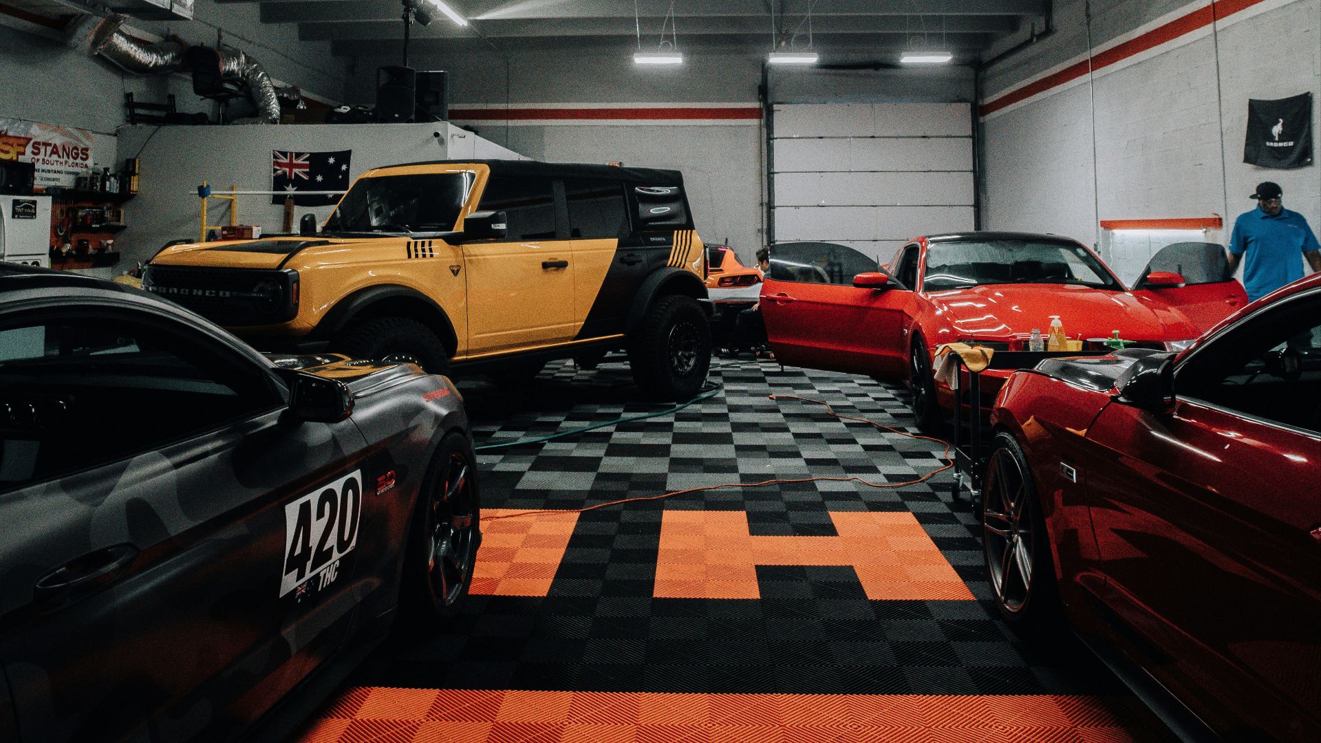 a garage filled with lots of different colored cars