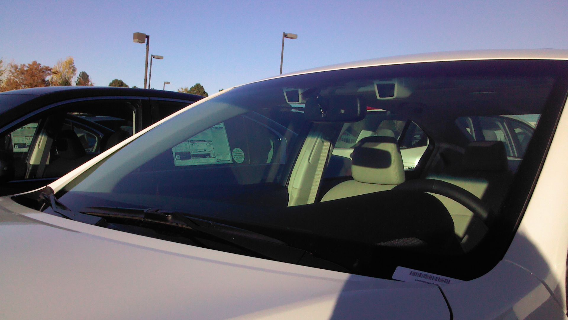 2014 Subaru Legacy 3.6R Limited with EyeSight technology cameras next to rear view mirror in Colorado