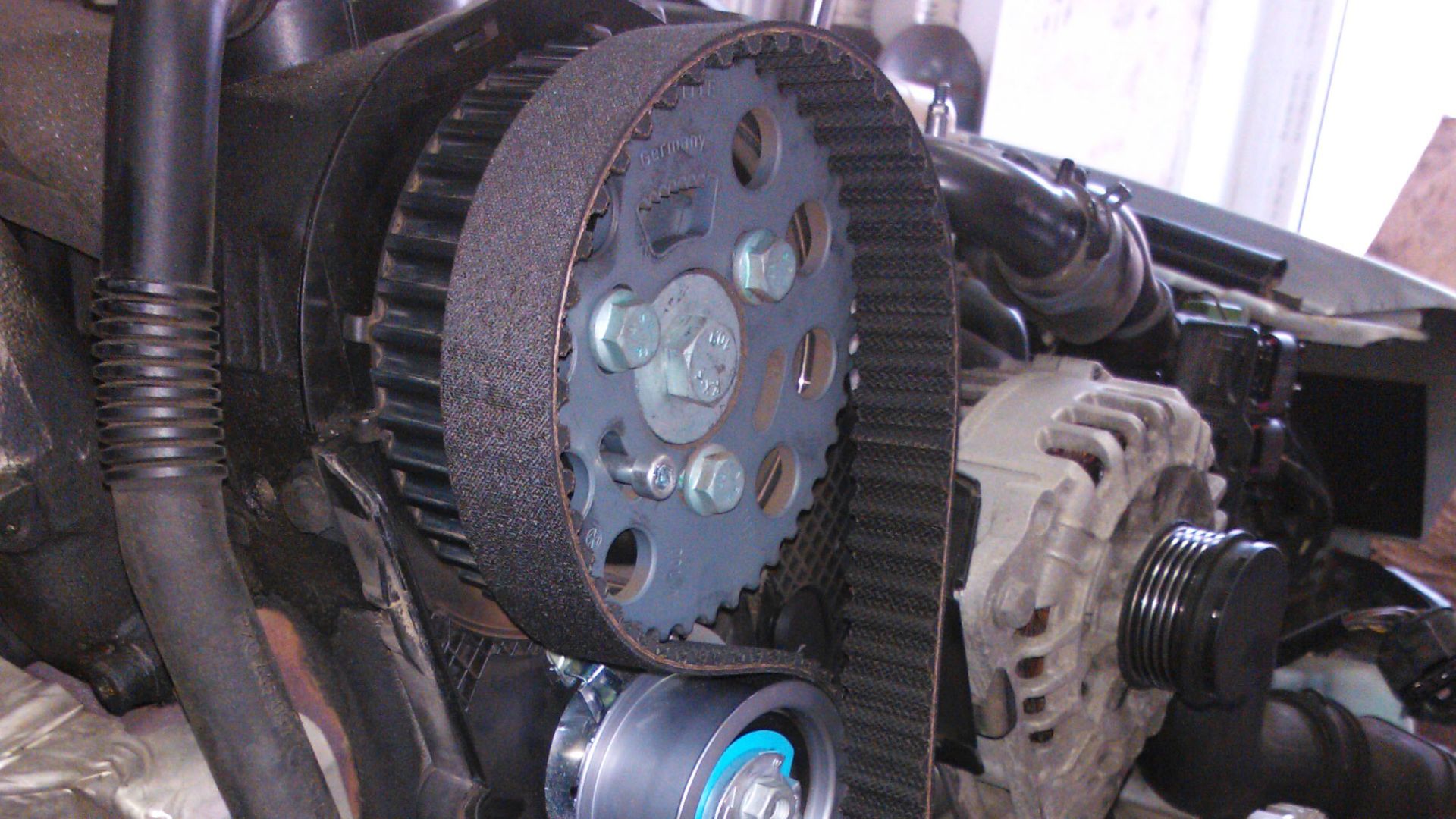 Replacing a timing belt of car.