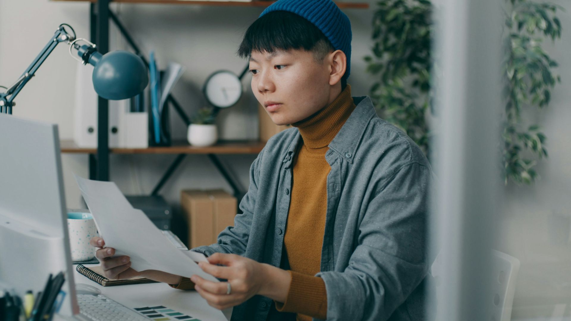 A person sitting at a desk with a computer