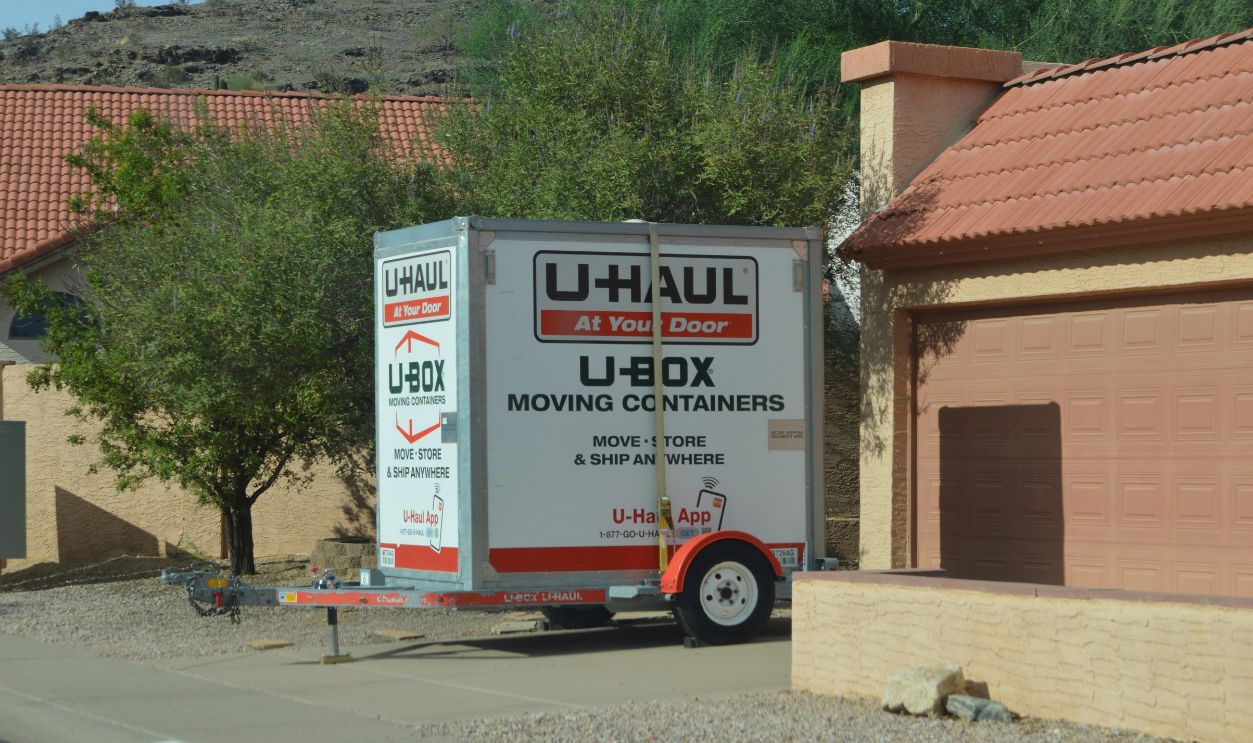 Phoenix, Arizona - Sept 17 2026: A U-Haul U-Box moving and storage container trailer sits parked in a residential neighborhood driveway