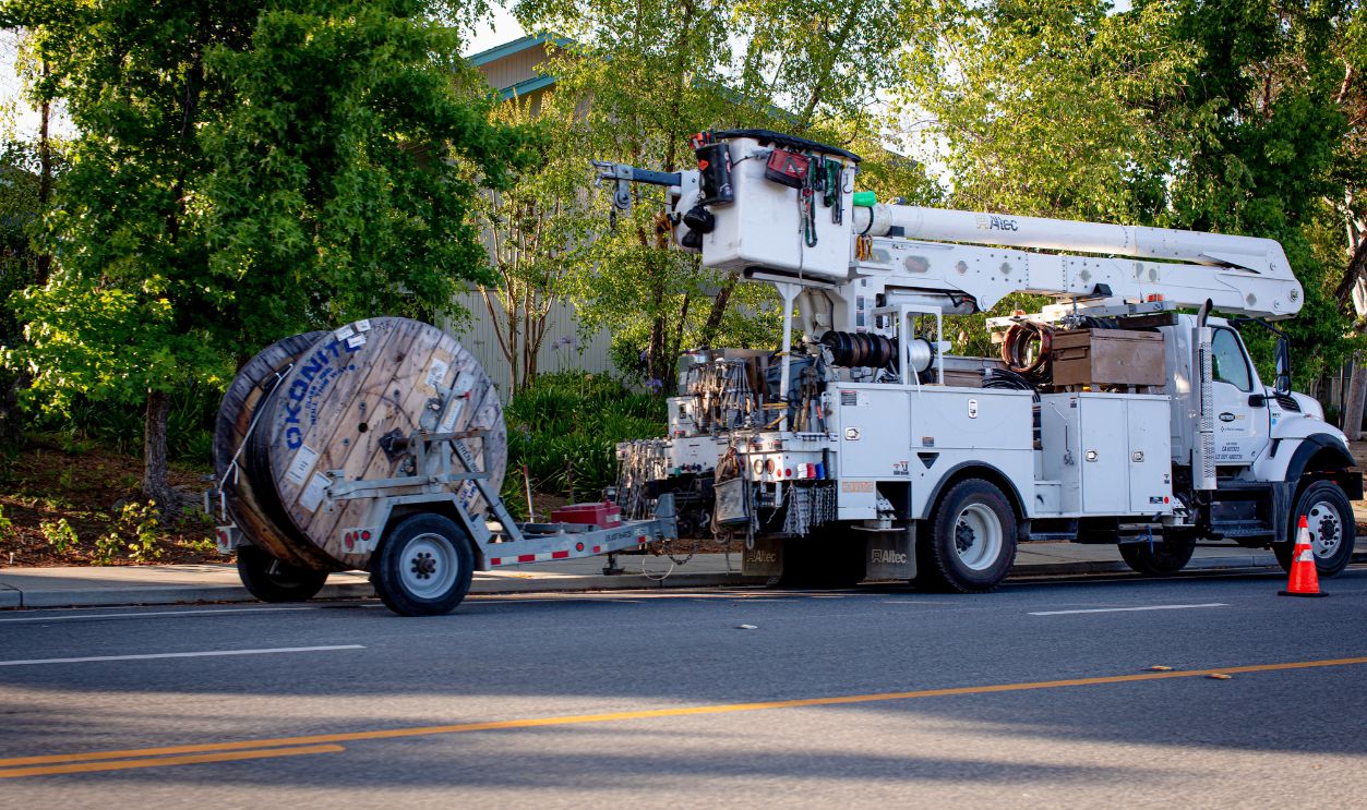 Sunnyvale, CA US - June 2, 2025: a utility vehicle park on the side of a street during some road work in a construction zone.