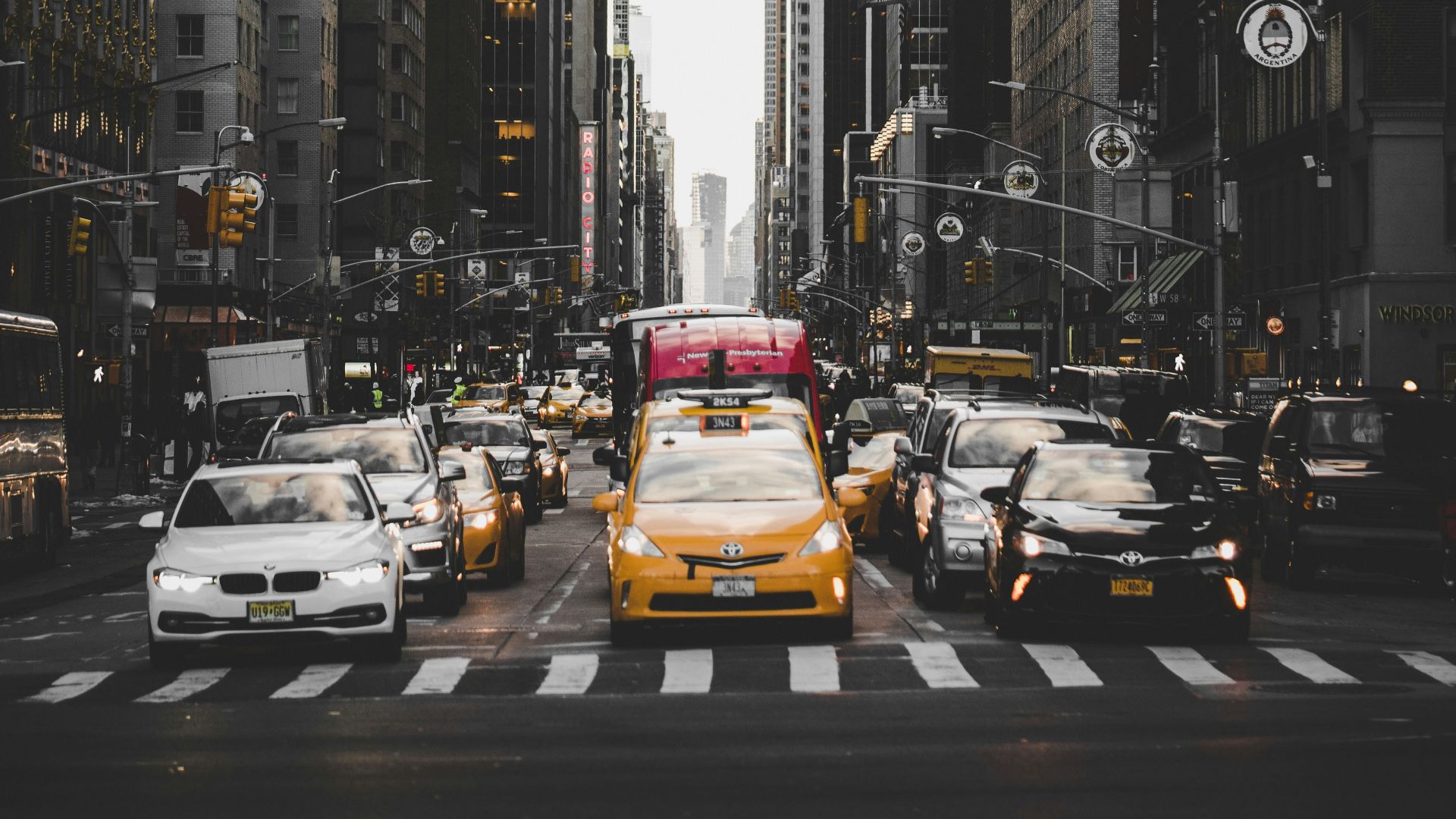 cars in between buildings