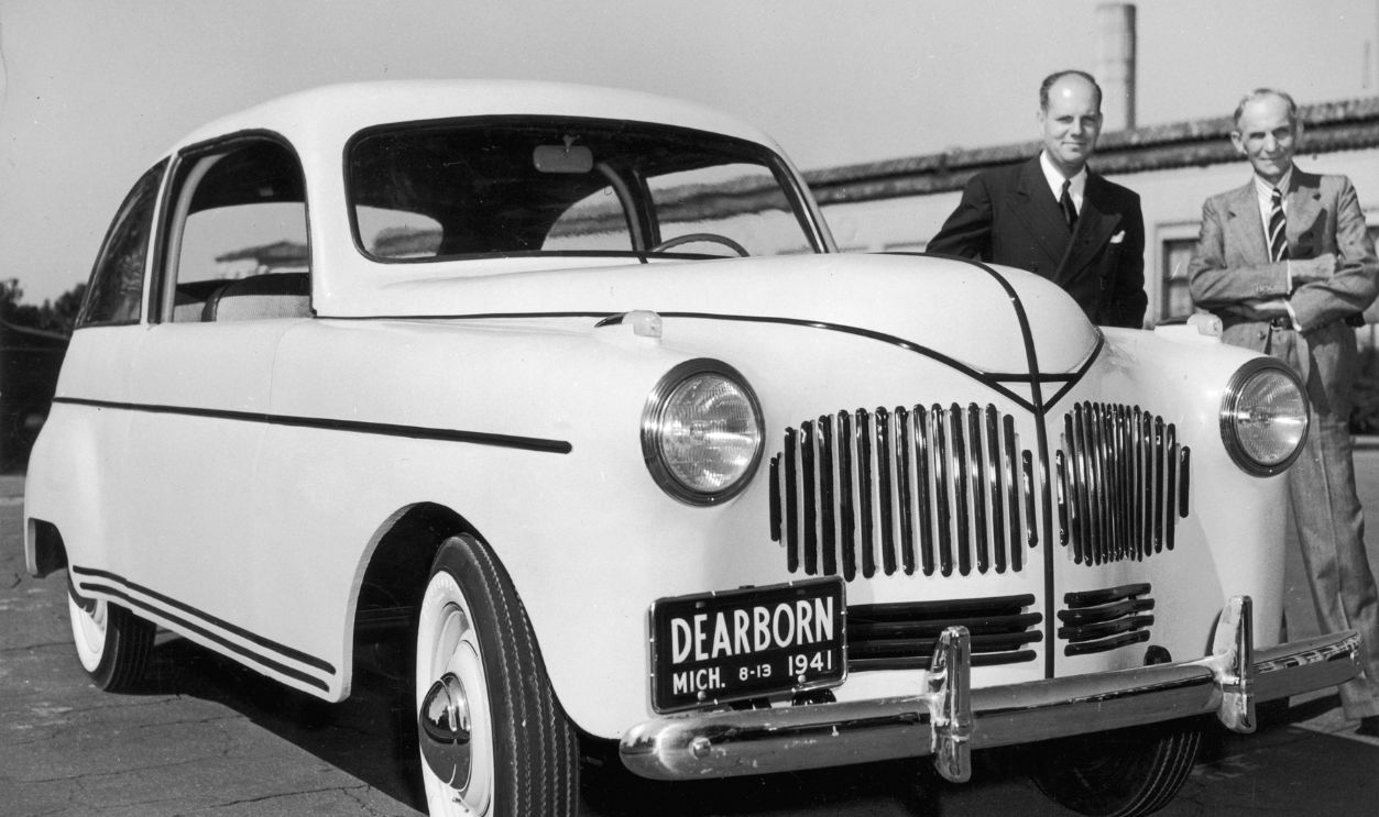 Henry & Edsel Ford 1941: American inventor and industrialist Henry Ford (R) and chemist Robert A Boyer standing next to the first Ford automobile to feature a plastic body, Dearborn, Michigan. 