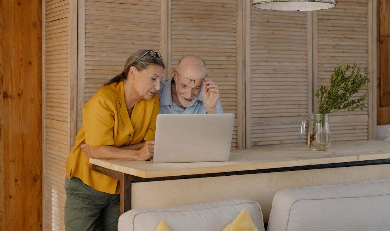 A Couple Looking at a Laptop