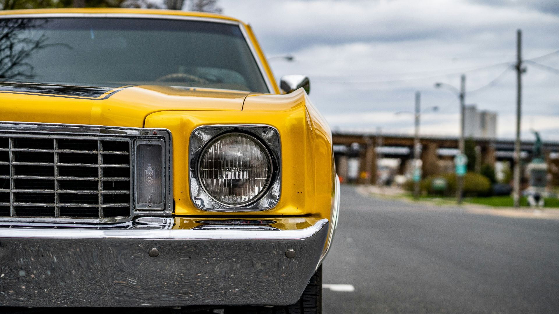 yellow car on road during daytime