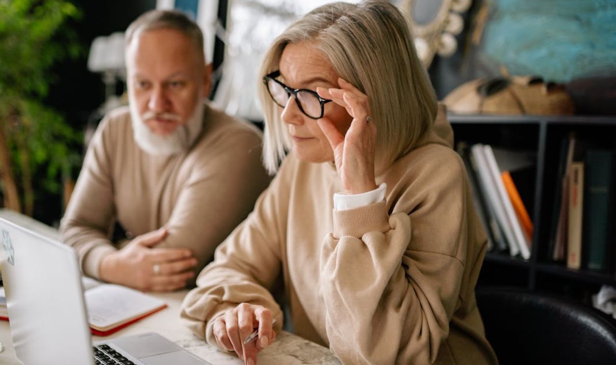 Man and Woman Sitting at the Table