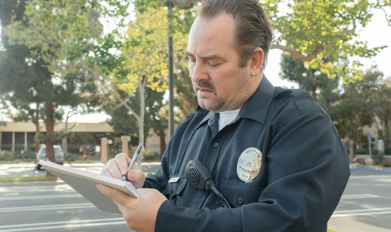 A Police Writing on a Paper