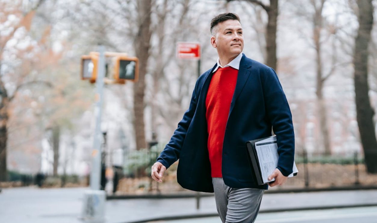 Photo Of Man Walking Beside The Street