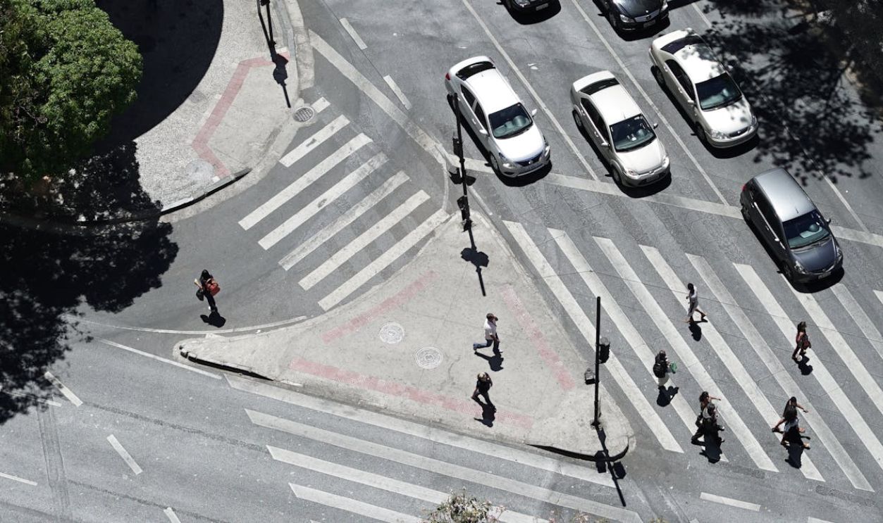People Walking on a Pedestrian Crossing