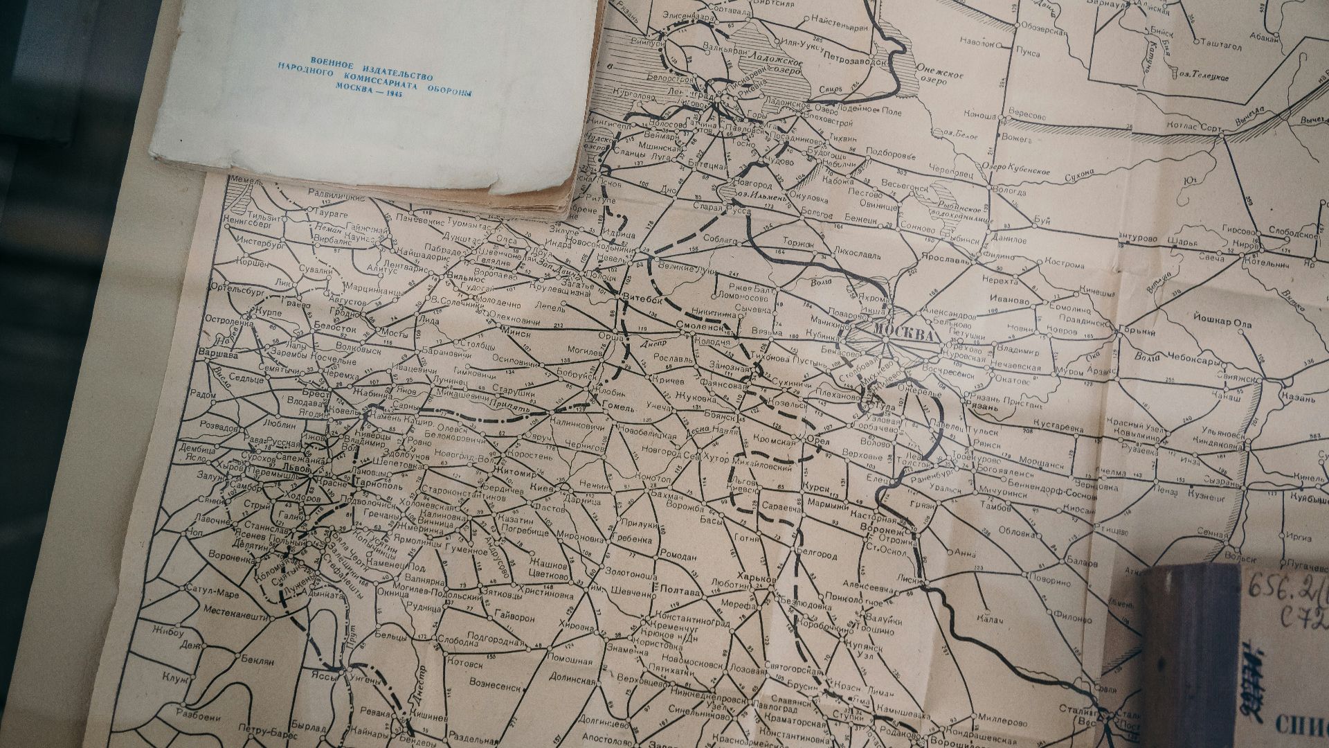 books on brown and gray map