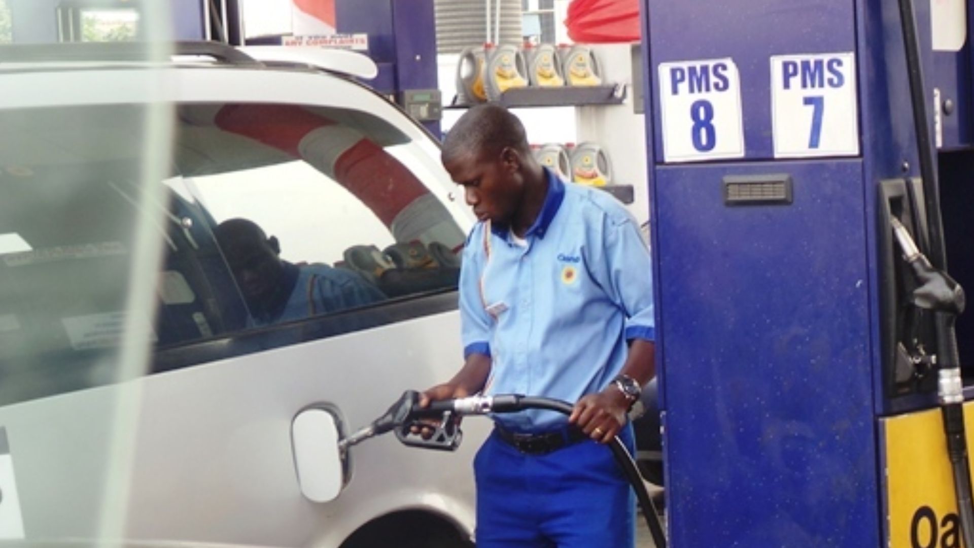 File:Petrol attendant in Lagos.jpg