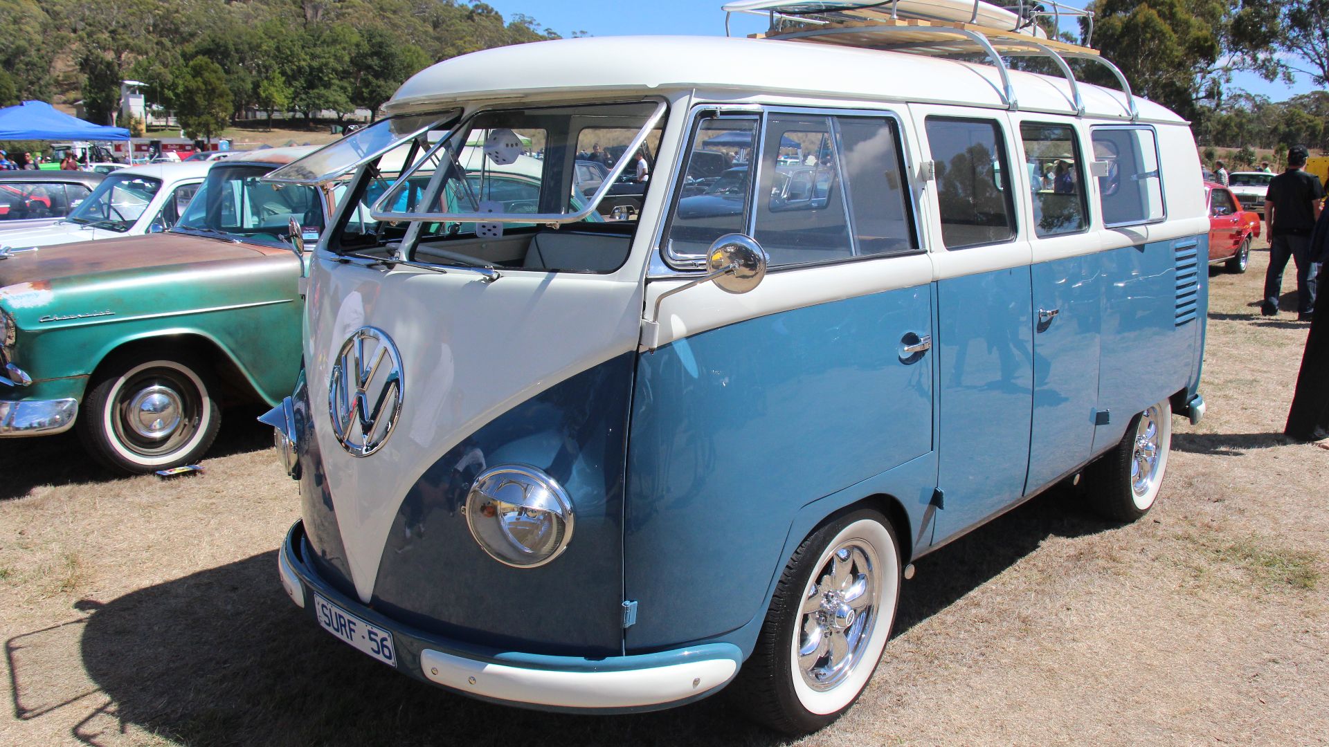 The Volkswagen Van was introduced in 1949, known as the Type 2 (the Beetle was the Type 1) 
Initially only the Panel Van (no side windows or seats) and Kombi  (some seats and some side windows) were available.  1300cc
1950; Microbus introduced (full side windows) 1131c
1951; Deluxe Microbus (samba) introduced with skylight windows and a canvas sliding roof, also Westfalia Camper and Ambulance
1952; Pickup available, Deluxe got chrome trim
1956; new body; roof extended over windscreen, 9 engine air louvres (was 8), bullet indicators replace semiphores on export models, smaller engine cover 1300cc
1957; larger tail lights
1961; Large oval indicators replace bullets
1963; air engine louvres now pressed inwards, push button door handles 1500cc
1964; Deluxe models no longer have rear qtr windows
1965; front indicators now amber

1968 The new Series II Bay introduced