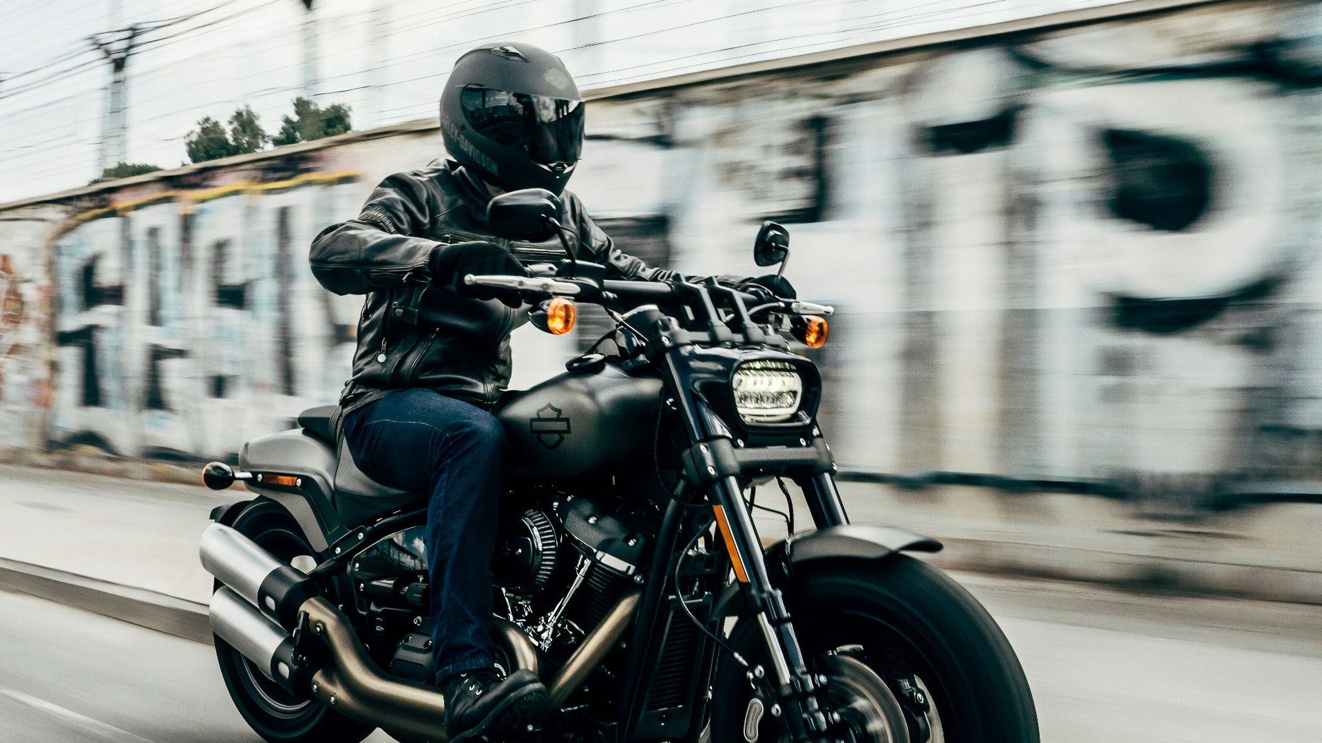person riding motorcycle on concrete road