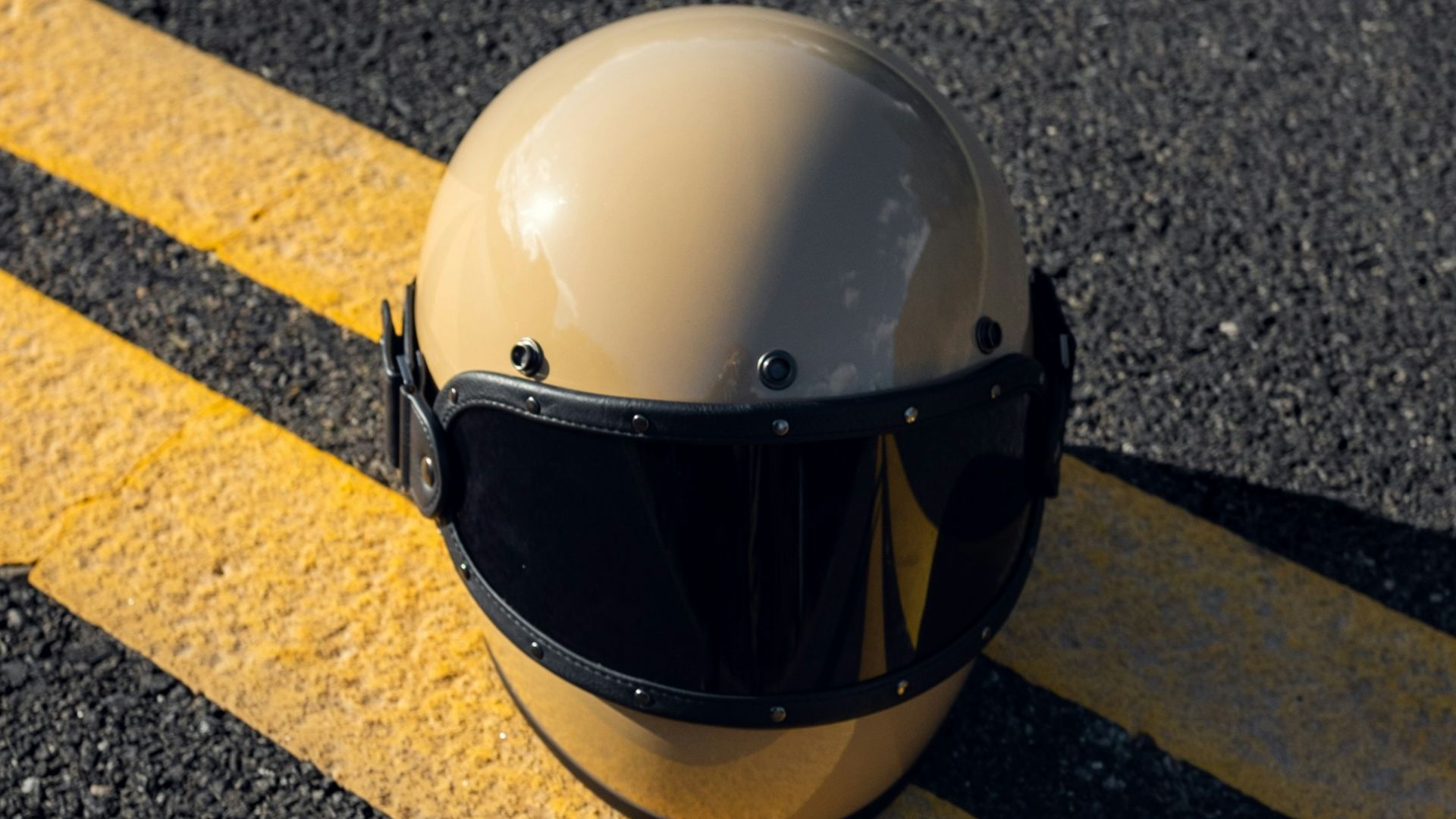 white helmet on grey concrete pavement