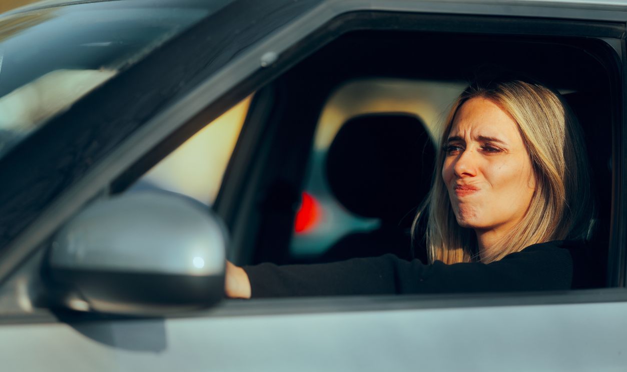 Stressed Driver Feeling Tired and Irritated in the Car. Angry frustrated lady experiencing stressful road trip