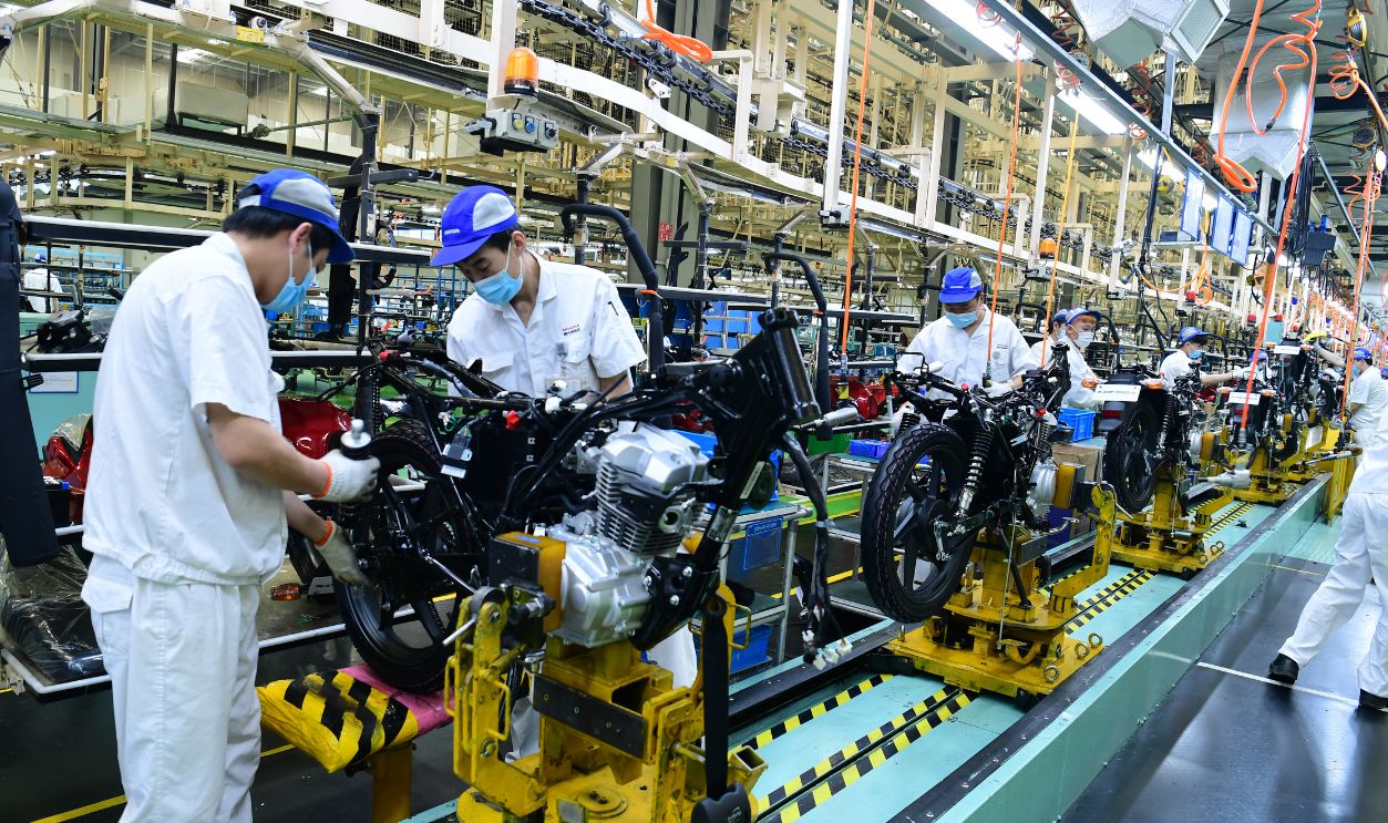 Motorcycle Manufacturer In Taicang TAICANG, CHINA - MAY 16: Employees work on the assembly line of motorcycles at a factory of Sundiro Honda Motorcycle Co., Ltd (SDH) on May 16, 2022 in Taicang, Suzhou City, Jiangsu Province of China.