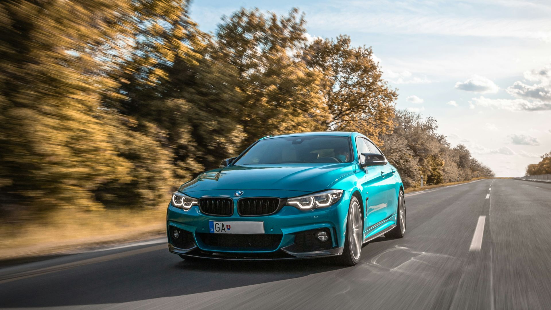 blue audi a 4 on road during daytime