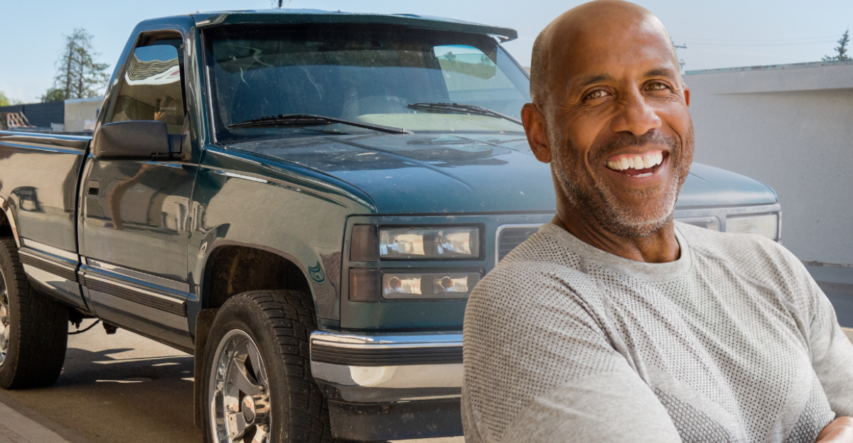 Brooks, Alberta - August 24, 2025: A 1998 GMC Sierra pickup truck, with new, shiny paint, was parked on the street.