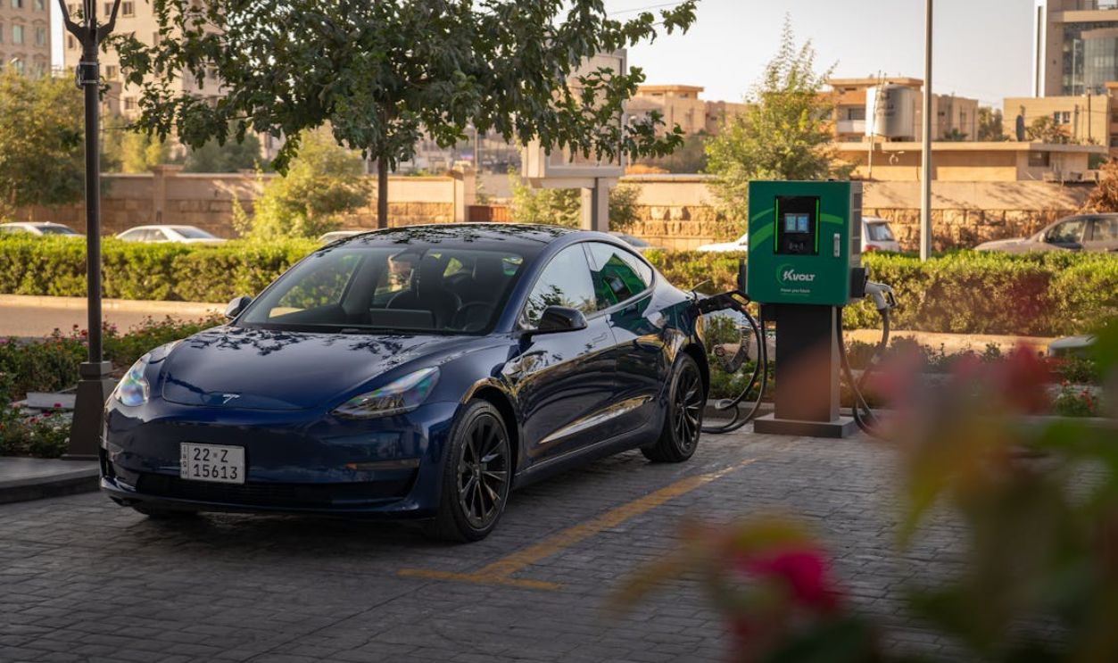 Electric Tesla Charging at Urban Station