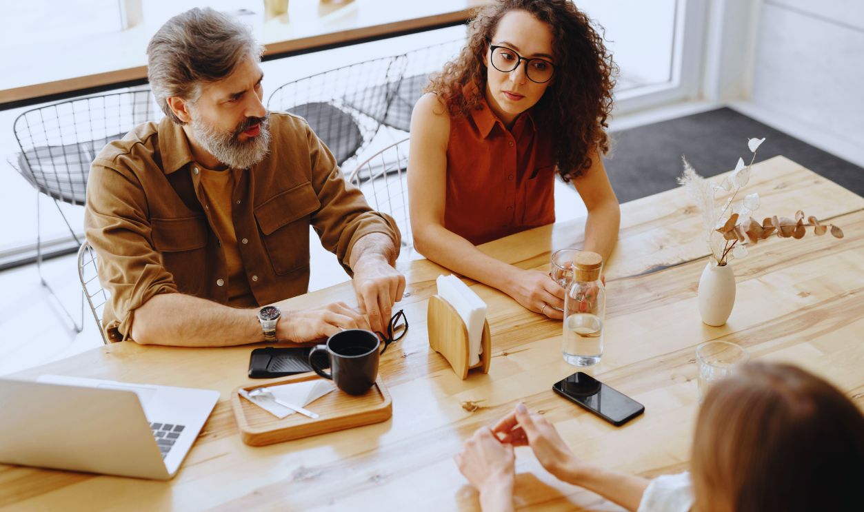 Women and a Man Having a Meeting