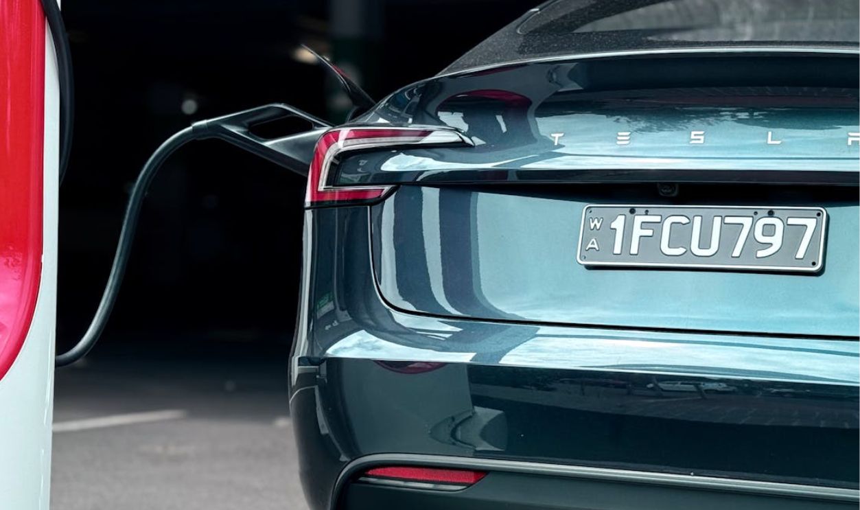 Electric Car Charging Station with Vehicle Plugged In