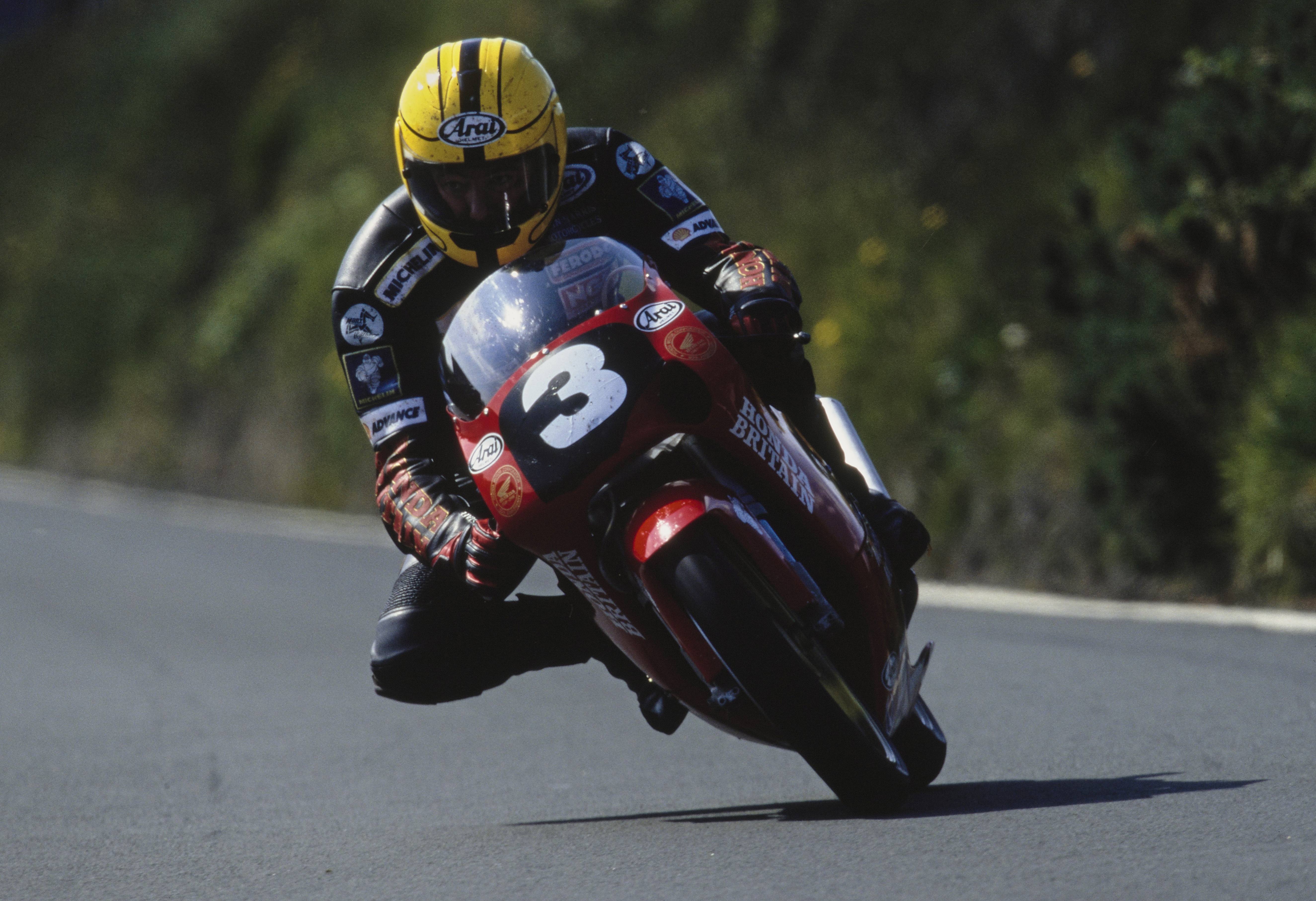 Joey Dunlop (1952 - 2000) from Northern Ireland, rides the #3 Andy McMenemy Motors McMenemy Honda 125 during the Ultra Lightweight TT Isle of Man Tourist Trophy Race on 10th June 1998 on the Isle of Man, United Kingdom. 