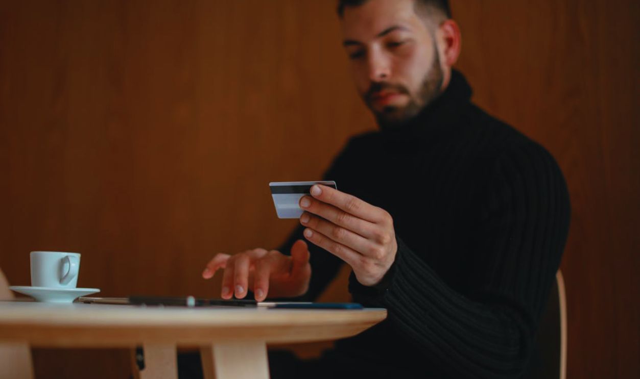 Man Shopping On-Line with Credit Card