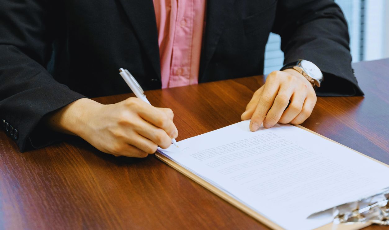 A Businessman Signing Documents