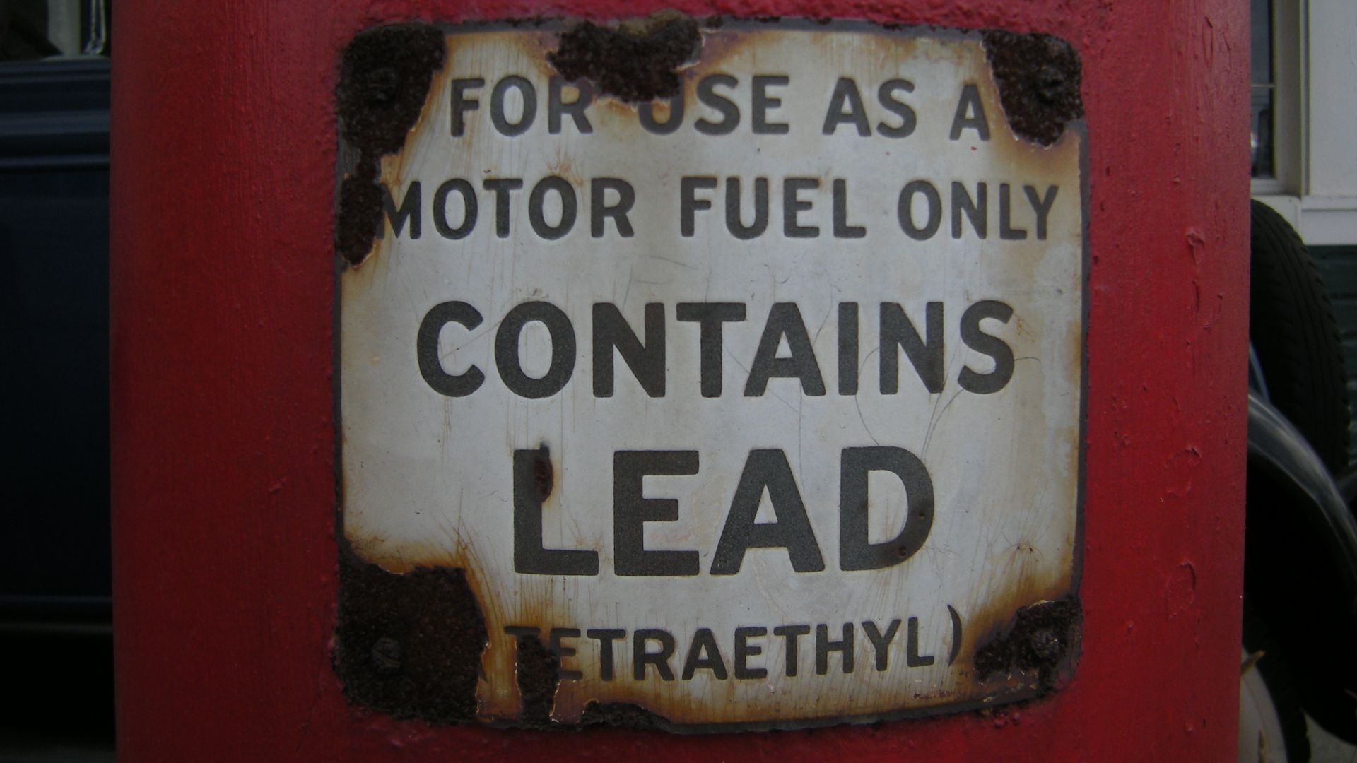 Lead warning on a gas pump at Keeler's Korner, Lynnwood, Washington. Keeler's Korner, a former grocery store and gas station (built 1927) listed on the National Register of Historic Places, listed 1982, NRHP listing #82004287.