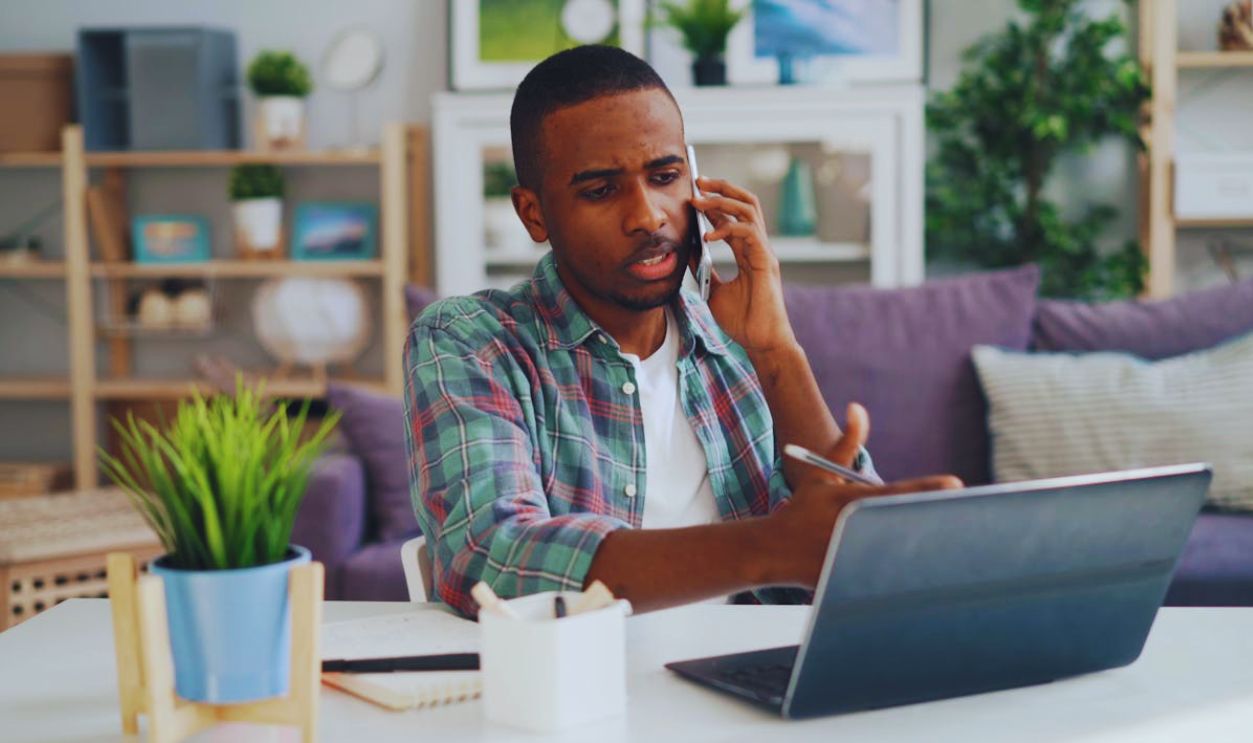 Man Working on Laptop at Home