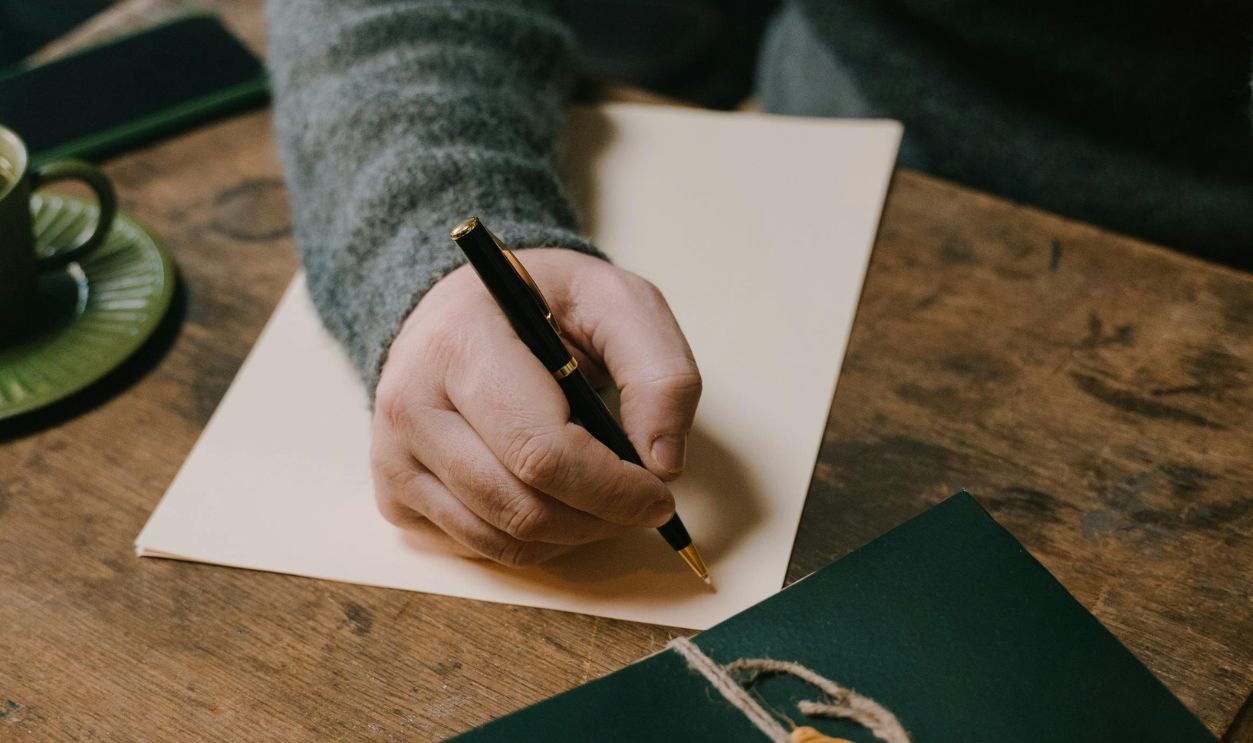 A Person Making a Personal Letter