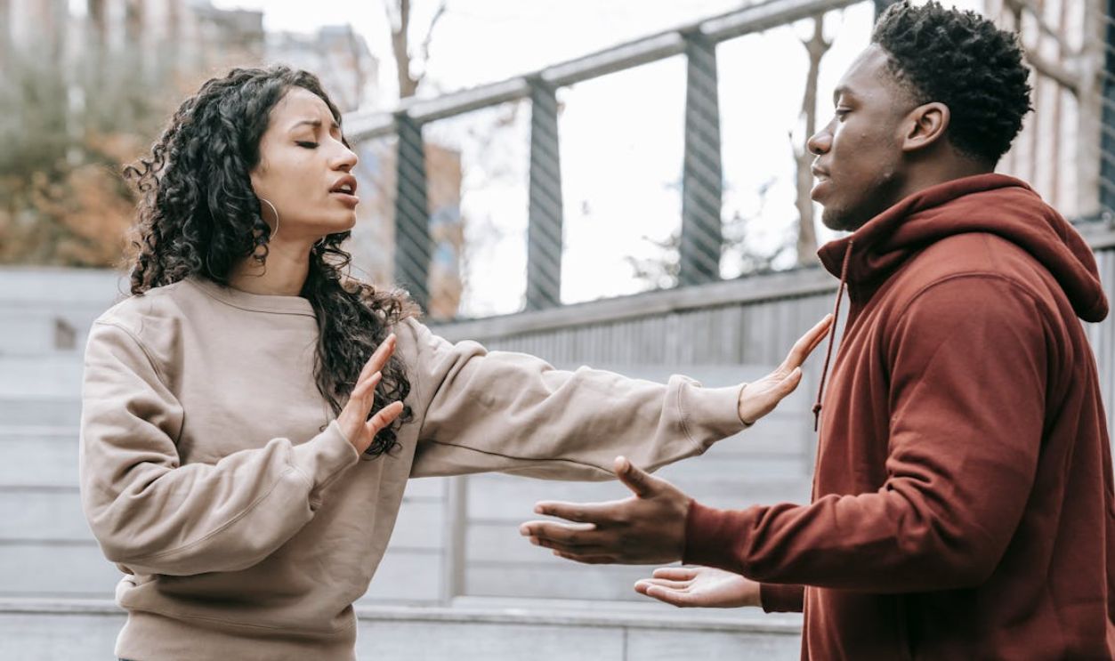 Multiracial couple having conflict on street