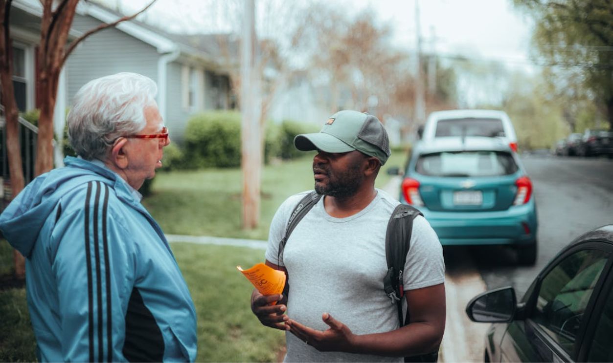 Men Standing on Sidewalk Arguing