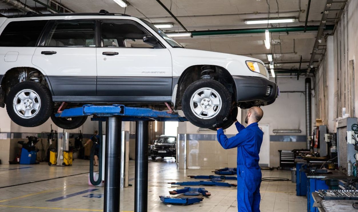 A Mechanic Inspecting a Vehicle