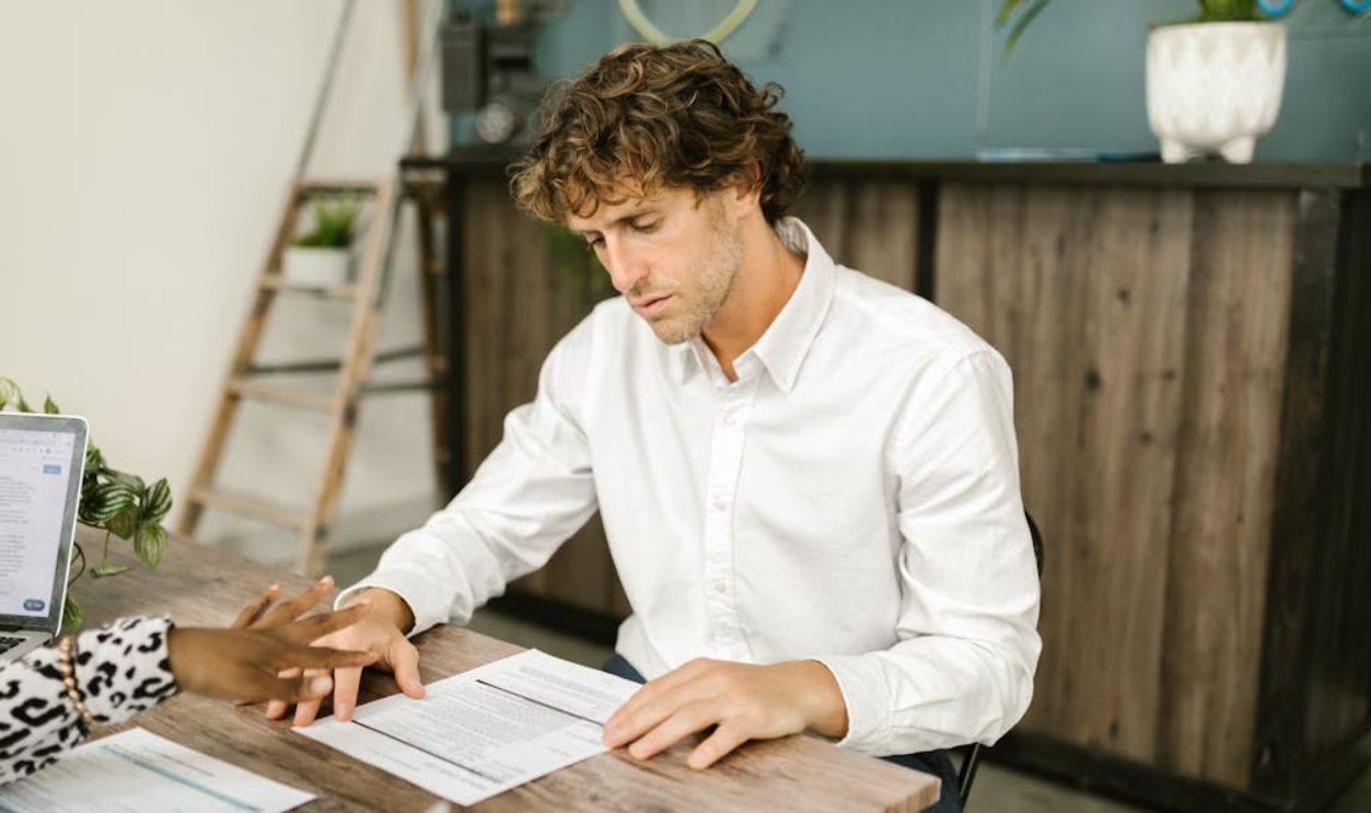 A Man Sitting at the Table