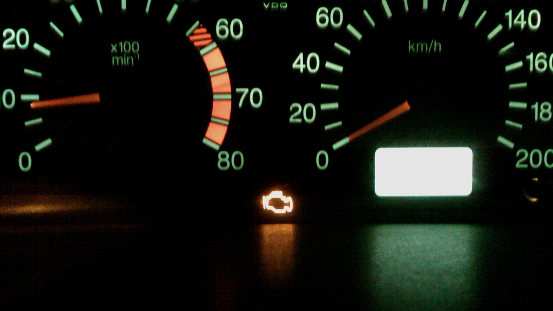 Check Engine lamp on a running engine indicating engine control system malfunction.