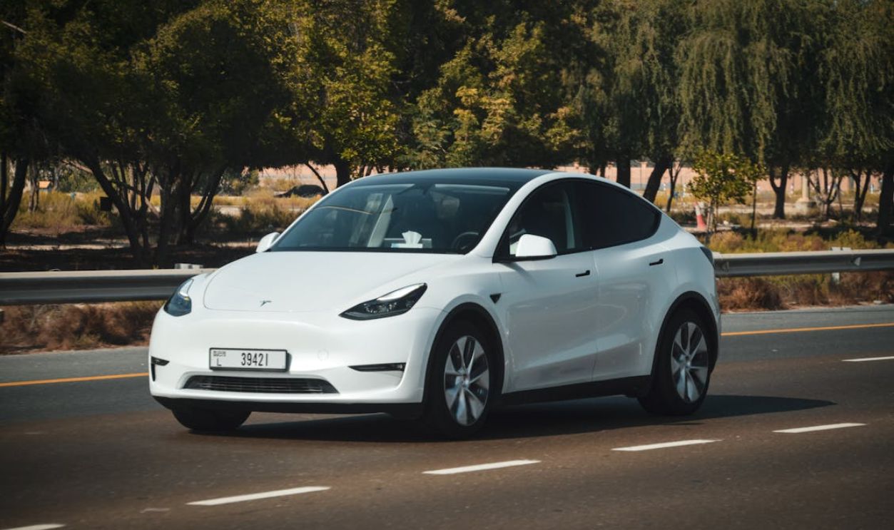 White Electric Car on Abu Dhabi Highway