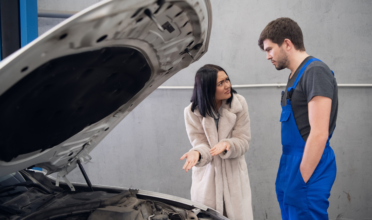 A client complains to a repairer about a bad car repair