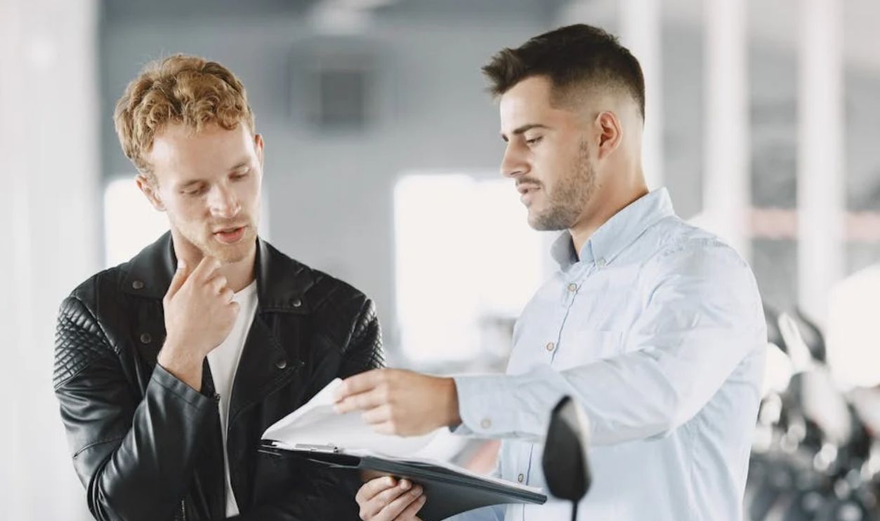 Customer Talking to the Motor Vehicle Dealer