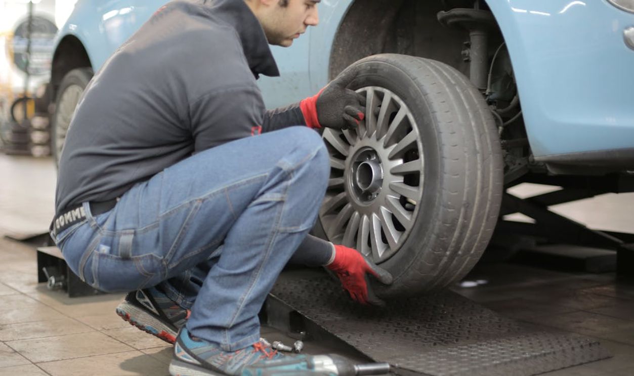 Man Changing a Car Tire